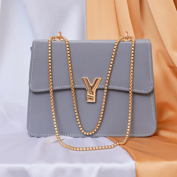 Elegant Grey Shoulder Bag with Gold Chain and Signature Y Charm